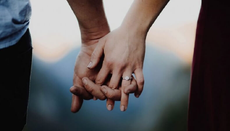 Engagement Ring Holding Hands