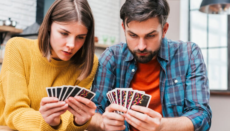 Couples playing cards